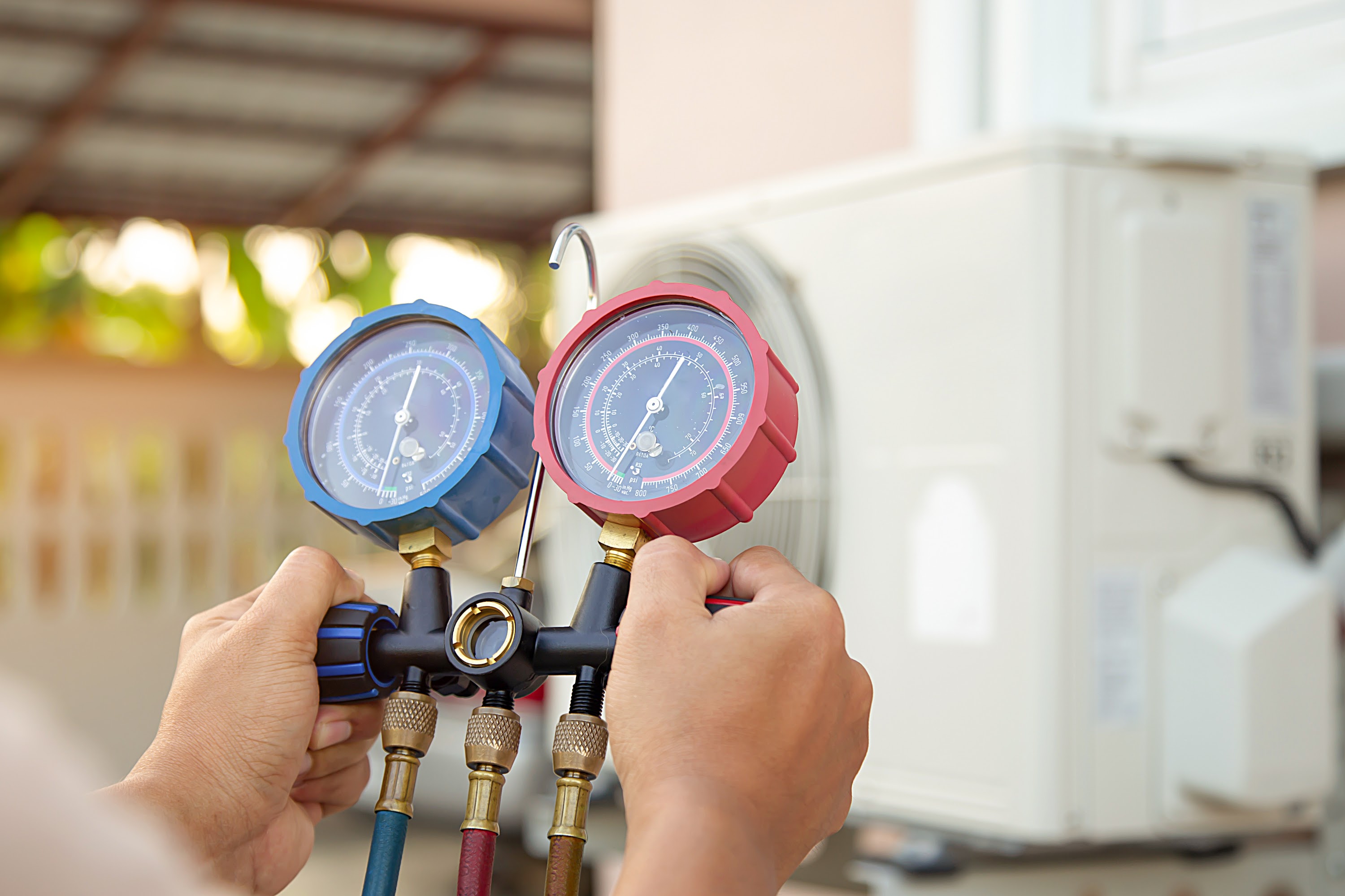 technician using gauges during tuneup